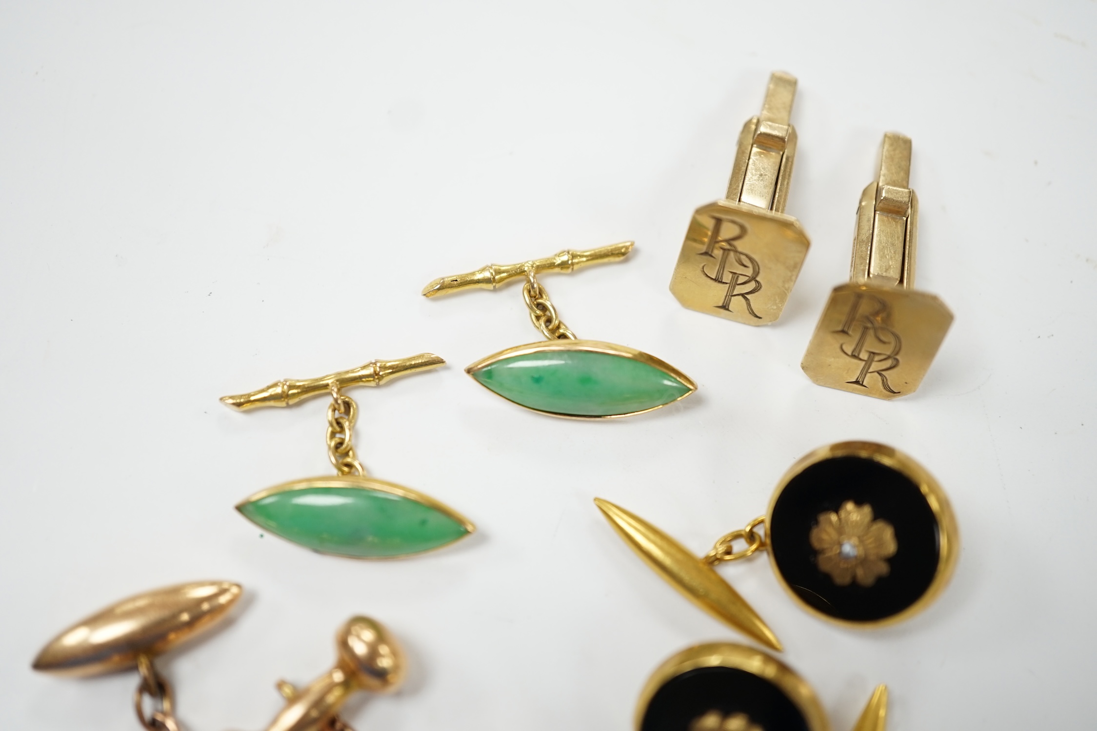 A pair of Edwardian 15ct gold torpedo shaped cufflinks, 9,6 grams and three other pairs of cufflinks including Chinese jade and monogrammed 9ct gold. Fair to good condition.